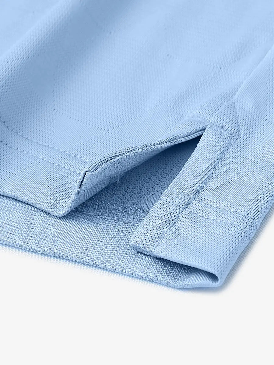 Close-up detail of hem opening on Modern Texture Stylish Polo in MISTY BLUE