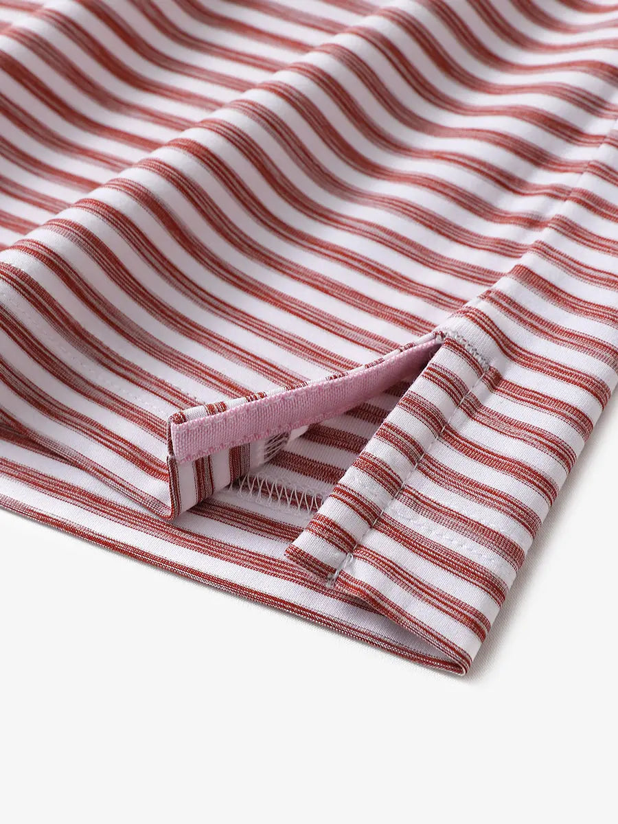 Hem slit detail on BRICK WHITE polo highlighting the painterly stripe effect and soft structure