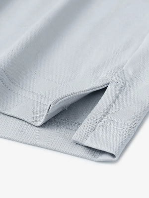 Close-up detail of hem opening on Modern Texture Stylish Polo in LIGHT GREY.