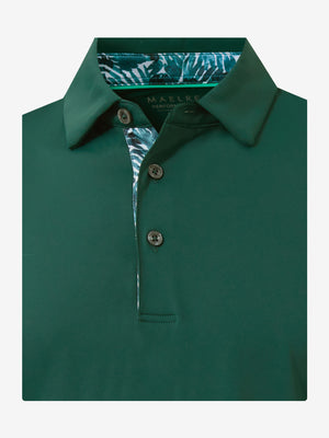 Flat lay of the folded blackish green everyday classic solid polo, showcasing the neat silhouette and solid color design