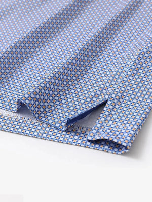 Hem slit detail of MAELREG Performance Jersey Print Polo in White Blue Circle – comfort & movement