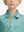 Close-up front view from nose to chest of boy wearing GREEN RUGBY Performance Print Boys Golf Polo