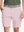 Front waist to knee view of pink water resistant golf 9 inch shorts, clean athletic fit.