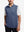 Upper body front view of model wearing colony blue melange lightweight sleeveless quarter zip golf vest