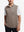Upper body front view of model wearing brown melange  lightweight sleeveless quarter zip golf vest
