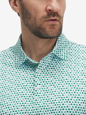 Front view from nose to chest of model wearing the green lucky clover 4 way stretch print collared polo shirt, showcasing the upper fit