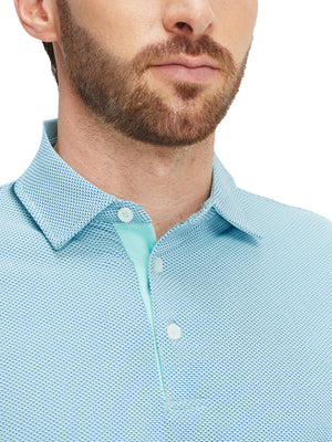 Close-up of a model wearing the aqua feather weight jacquard polo shirts, focusing on the collar and face