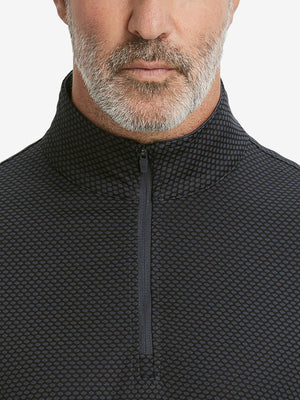 Close-up of collar area on jacquard quarter zip pullover in dark grey/black, highlighting refined jacquard detail.