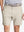 Front view of youth wearing cream Heather Performance Golf Shorts, showing fit and style