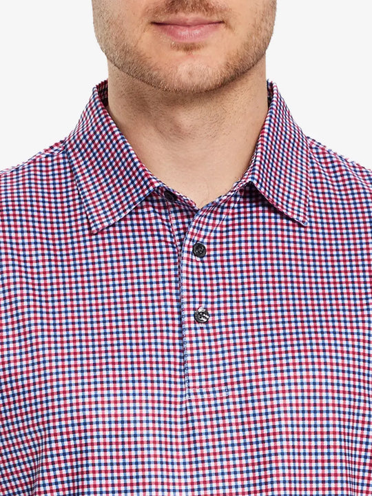 Model wears a RED BLUE GINGHAM golf polo shirt, which emphasizes its cut and comfort when viewed from nose to chest