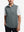 Upper body front view of model wearing grey melange lightweight sleeveless quarter zip golf vest