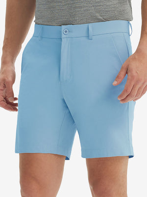 Front lower body shot of model wearing the light blue stretch soft flat front dress golf shorts, showcasing the fit