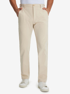 Model wearing Golf Lightweight Fleece Lined Dress Pants in light khaki, lower body front view