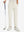 Boys Stretch Fleece Lined Casual Golf Pants in beige, front lower body view with golf club