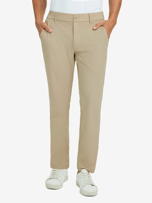 Front lower body view of model with hand in pocket, wearing quick dry casual dress pants in khaki.