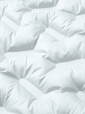 Fabric close-up showing the material of light grey boys full-zip fleece-lined puffer vest.