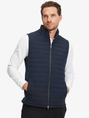 Model wearing Lightweight Water Resistant Puffer Vest in navy, upper body front view