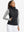 Front upper body of model wearing women's lightweight slim-fit puffer vest, sleek fit in black
