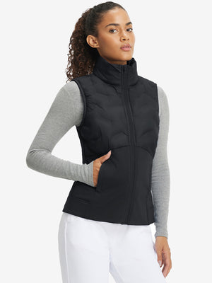 Front upper body of model wearing women's lightweight slim-fit puffer vest, sleek fit in black