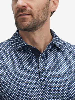 Close-up of lower face and upper shirt in Performance quick dry print golf polos, blue white stars detail