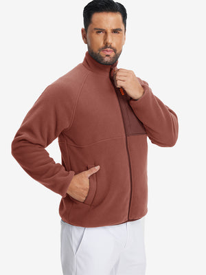 Model wearing the reversible fleece jacket with 5 pockets in maroon, casually posing with one hand in the pocket for a stylish, practical look.
