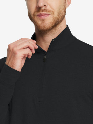 Model wearing quarter zip melange pullover, black, front upper-body with relaxed fit.