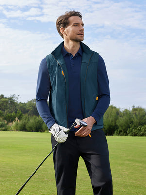 Model holding a golf club, upper body shot from head to knees, wearing dark blue windproof fleece reversible golf vest.