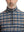 Close-up from nose to chest, showing zipper collar detail and fabric pattern of the blue/white/yellow plaid pullover.