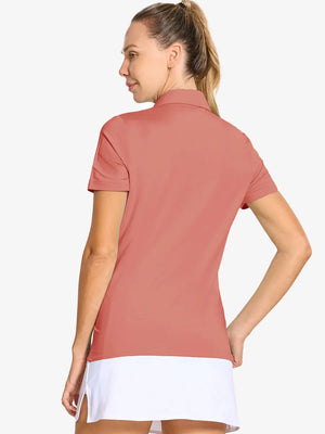 Back-side half-body shot of model in CORAL PINK Women's Performance Solid Polo, looking over shoulder