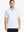Front half-body view of male model in the White Everyday Classic Solid Polo, standing still