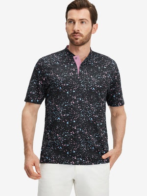 Front half-body of model in black splatter stretch printed collarless henley golf shirts