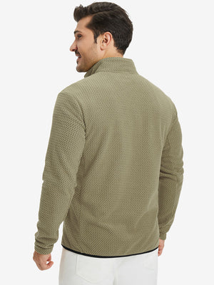 Back upper view of model in midweight warm stretchy quarter zip pullover, highlighting shoulder fit in desert yellow.