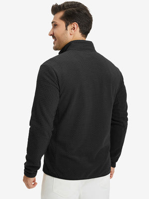 Back upper view of model in midweight warm stretchy quarter zip pullover, highlighting shoulder fit in black.