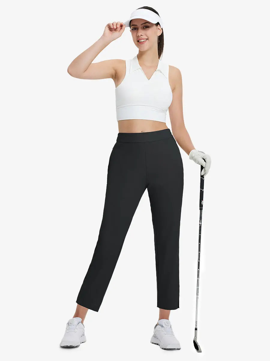 Full-body front view wearing golf hat and holding club in BLACK Women's 7/8 Ankle Golf Track Pants.