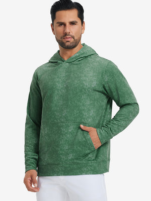 Model in green exclusive print kangaroo hoodies with hands in pocket, relaxed front upper view.