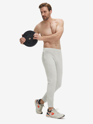 Model wearing khaki grey superion softness mesh joggers with zipper pockets in motion