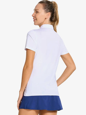 Back-side half-body shot of model in WHITE Women's Performance Solid Polo, looking over shoulder
