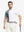 Half-body front view of model holding golf club wearing WHITE Moisture Wicking Color Block Polo Shirt.