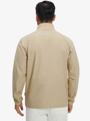 Back view of lightweight water-resistant outerwear jacket on model, showing khaki design