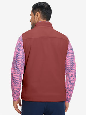 Model's upper body back view wearing maroon windproof fleece reversible golf vest.