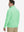 Back upper body view of the light green lightweight golf pullover, model turns head slightly with ease.