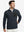 Model with one hand in side pocket, wearing midweight warm stretchy quarter zip pullover in navy.