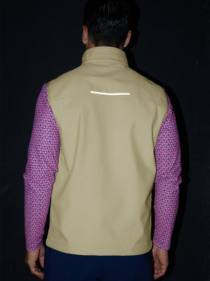 Model back half-body shot showcasing sleeveless softshell fleece outdoor vests with 6 pockets in light khaki