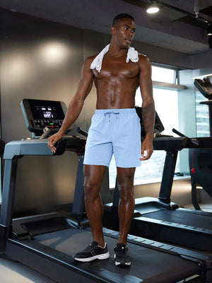 Full-body gym view of model in LIGHT BLUE 2 in 1 Running Sports Shorts with Liner