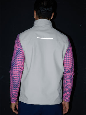 Model back half-body shot showcasing sleeveless softshell fleece outdoor vests with 6 pockets in light gray