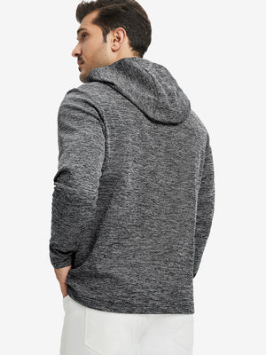 Back view of model wearing texture solid hoodies pullover showing fit and hood detail, black heather.