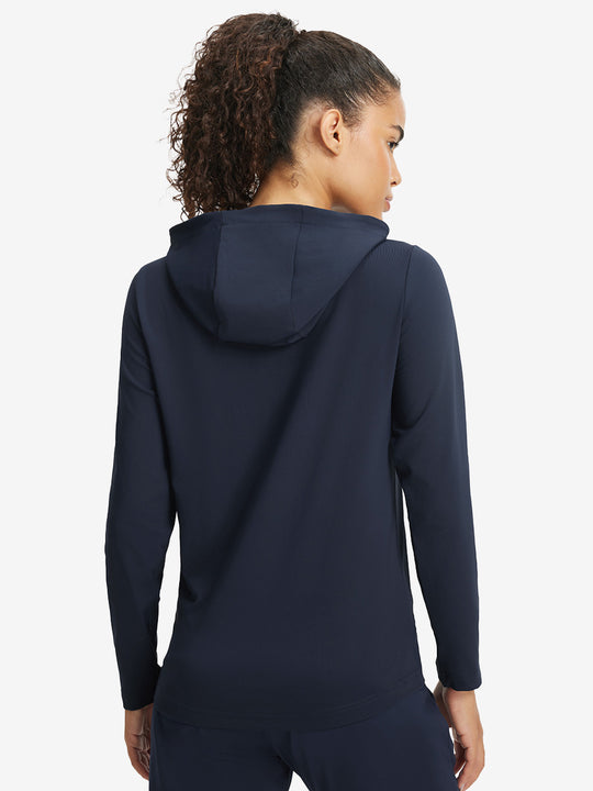 Back upper view of model in women's lightweight hoodies pullover, showing relaxed fit in navy.