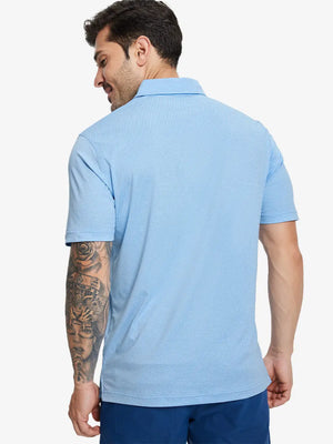 Back half-body view of model in BLUE HEATHER Premium Stretch Heather Polo.