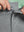 LIGHT GREY 9 Inch Heather Performance Golf Shorts close-up of waistband being stretched to show elasticity
