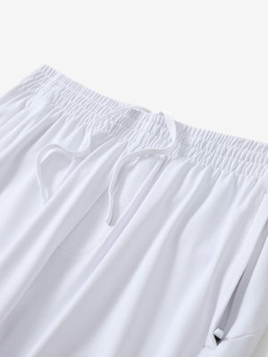 Angled view of lightweight women's stretchy joggers sweatpants waistband displayed in white.